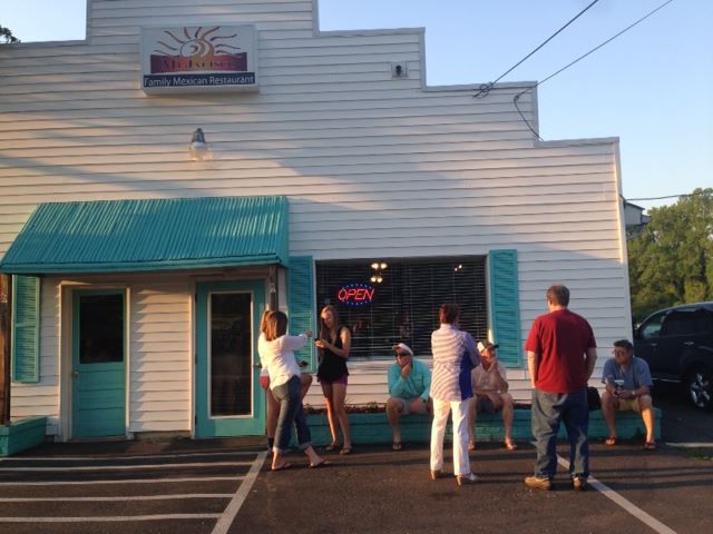 Patrons waiting outside the front of Mi Jalisco restaurant