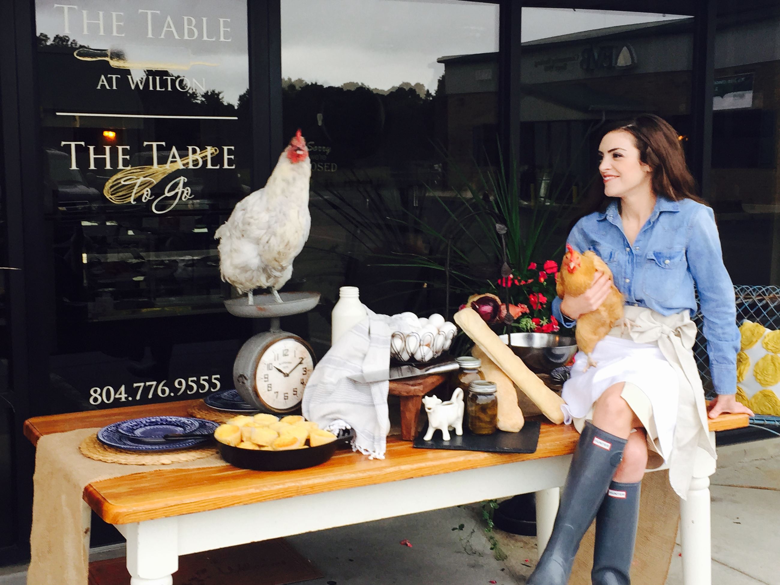Patron sitting at an outdoor table at The Table to Go restaurant