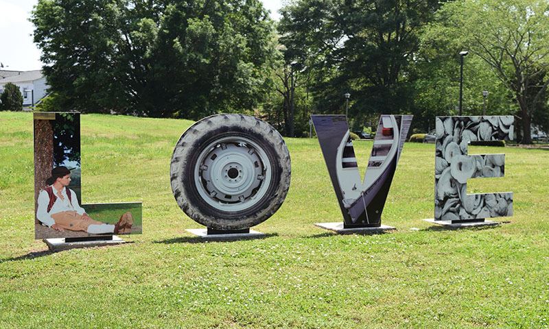A block letter display spelling LOVE with Middlesex attractions painted on the front