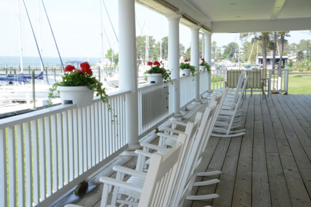 Dozier's Regatta Point Yachting Center porch with rocking chairs overlooking the ocean