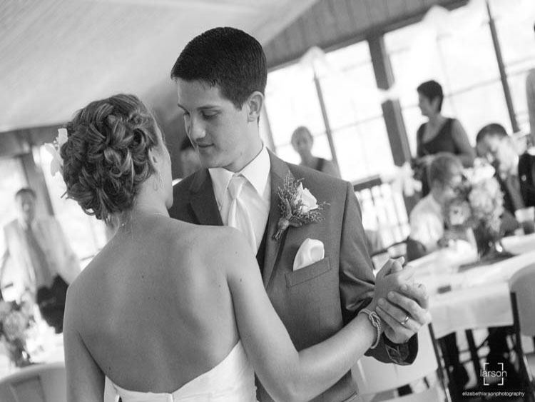 Bride and groom dancing at their wedding, held at the Piankatank Golf Clubhouse